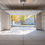 Unfinished garage walls with level-one drywall seams in a bright Milwaukee neighborhood